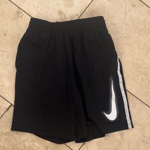 Nike Youth XL Black Athletic Shorts with White Swoosh Accent